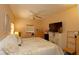 Comfortable main bedroom features a ceiling fan, neutral paint, a window and a large TV at 2132 40Th N Ave, St Petersburg, FL 33714