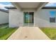 Covered back porch with a sliding glass door leading to the outside at 22196 Calisto Way, Land O Lakes, FL 34637