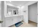 Bright bathroom with a double vanity, a large mirror, and ample storage space at 22196 Calisto Way, Land O Lakes, FL 34637