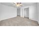 A bright bedroom featuring neutral carpet and a walk-in closet at 22196 Calisto Way, Land O Lakes, FL 34637
