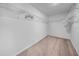 Organized walk-in closet with wire shelving for optimal storage and accessibility at 22196 Calisto Way, Land O Lakes, FL 34637