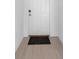 Close up of the front door showing the tile flooring of the entryway at 22196 Calisto Way, Land O Lakes, FL 34637