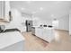 Bright eat-in kitchen with a gas range, stainless steel appliances, and an island with a sink and dishwasher at 22196 Calisto Way, Land O Lakes, FL 34637