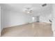 Bright living room with tile floors and a view into the kitchen area at 22196 Calisto Way, Land O Lakes, FL 34637