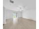 A bright living room with a sliding glass door and neutral tile flooring at 22196 Calisto Way, Land O Lakes, FL 34637