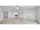 Spacious, bright living room open to the kitchen featuring tile floors at 22196 Calisto Way, Land O Lakes, FL 34637