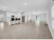 Open-concept living space with tile flooring and a bright kitchen and living area at 22196 Calisto Way, Land O Lakes, FL 34637