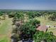 An aerial view showcasing the golf course within a lush, green community at 2241 Shelly Dr # D, Palm Harbor, FL 34684