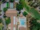 A vibrant community pool and recreation area with a golf course nearby is shown in this aerial view at 2241 Shelly Dr # D, Palm Harbor, FL 34684