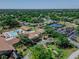 An aerial view shows a community with tennis courts, pool, and clubhouse at 2241 Shelly Dr # D, Palm Harbor, FL 34684