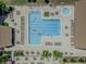 Aerial view of a large community pool with ample seating and lush landscaping at 2241 Shelly Dr # D, Palm Harbor, FL 34684