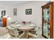 A dining area showcases a round table set for four, with a china cabinet at 2241 Shelly Dr # D, Palm Harbor, FL 34684