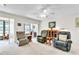 Relaxing living room with comfortable seating, a bright atmosphere, and a view of the enclosed patio at 2241 Shelly Dr # D, Palm Harbor, FL 34684