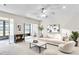 Inviting living room with a cozy fireplace, comfortable seating, and a view of the outdoor area at 2241 Shelly Dr # D, Palm Harbor, FL 34684