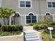 Charming home featuring white trim windows, a well-manicured yard, and a welcoming entrance at 232 Columbia Dr, Tampa, FL 33606