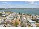 An aerial view of a neighborhood near the bay with well-maintained streets and diverse architectural styles at 251 72Nd Ave, St Pete Beach, FL 33706
