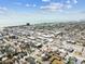 A cityscape with well-organized streets, diverse housing, and views of the ocean can be seen from the air at 251 72Nd Ave, St Pete Beach, FL 33706