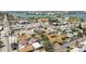 A vibrant neighborhood with colorful houses and clear roads can be seen from an aerial perspective at 251 72Nd Ave, St Pete Beach, FL 33706
