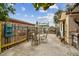 Backyard patio showcasing an outdoor dining set, lush landscaping, and fenced perimeter, perfect for outdoor living at 251 72Nd Ave, St Pete Beach, FL 33706