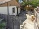 Backyard featuring an outdoor dining area and a fenced yard offering privacy and space for relaxation at 251 72Nd Ave, St Pete Beach, FL 33706