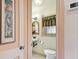 Cozy bathroom with a unique mirror over the vessel sink, and attractive pelican artwork at 251 72Nd Ave, St Pete Beach, FL 33706