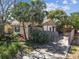 Home with a well-maintained yard, fenced-in area, and inviting curb appeal, showcasing its outdoor space at 251 72Nd Ave, St Pete Beach, FL 33706