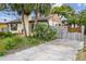 Charming single-story home with lush landscaping, palm trees, and inviting curb appeal in a desirable neighborhood at 251 72Nd Ave, St Pete Beach, FL 33706