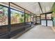 Enclosed patio featuring neutral color hard flooring, laundry area and views of the backyard at 251 72Nd Ave, St Pete Beach, FL 33706