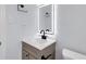 Modern bathroom featuring updated sink, faucet, and a lighted mirror at 2801 Poinciana Ct, Punta Gorda, FL 33950