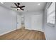 Bedroom featuring hardwood floors, ceiling fan, closet and a window with natural light at 2801 Poinciana Ct, Punta Gorda, FL 33950