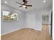 Bedroom with ceiling fan, closet, wood-look floors and natural light at 2801 Poinciana Ct, Punta Gorda, FL 33950