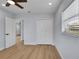 Bedroom with ceiling fan, closet, wood-look floors and natural light at 2801 Poinciana Ct, Punta Gorda, FL 33950