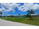 Charming single-story home with a well-maintained front yard and lush green lawn at 2801 Poinciana Ct, Punta Gorda, FL 33950