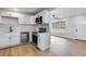Stylish kitchen with modern appliances, white cabinetry, and an open layout perfect for entertaining guests at 2801 Poinciana Ct, Punta Gorda, FL 33950