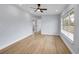 Spacious room with hardwood floors, ceiling fan and plenty of natural light at 2801 Poinciana Ct, Punta Gorda, FL 33950