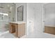 Bathroom featuring a glass-enclosed shower and a modern vanity area at 3406 W Alline Ave, Tampa, FL 33611