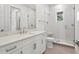 Bright bathroom featuring herringbone tile shower, stone countertop vanity, and glass shower door at 3406 W Alline Ave, Tampa, FL 33611