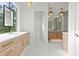 Bright bathroom featuring dual vanities, ample counter space, and modern fixtures at 3406 W Alline Ave, Tampa, FL 33611