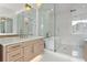 Luxurious bathroom features glass shower, soaking tub, and elegant fixtures at 3406 W Alline Ave, Tampa, FL 33611