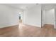Bright bedroom features wood flooring and neutral walls, creating a serene and inviting atmosphere at 3406 W Alline Ave, Tampa, FL 33611