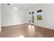 Bright bedroom with doors to balcony, showcasing ample natural light and outdoor access at 3406 W Alline Ave, Tampa, FL 33611