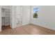 Bedroom features hardwood flooring and an ensuite bathroom and closet at 3406 W Alline Ave, Tampa, FL 33611
