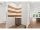 Welcoming entryway featuring board and batten walls with a corkboard stripe and storage bench at 3406 W Alline Ave, Tampa, FL 33611