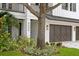 Beautiful house number detail with an immaculate front lawn and a three-car garage at 3406 W Alline Ave, Tampa, FL 33611