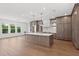 Expansive kitchen boasts a large island, custom cabinets, and stainless steel appliances at 3406 W Alline Ave, Tampa, FL 33611