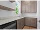 Wet bar features a quartz countertop, custom cabinets, open shelves and a beverage cooler at 3406 W Alline Ave, Tampa, FL 33611