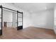Bright, open living area with a modern sliding barn door and hardwood floors at 3406 W Alline Ave, Tampa, FL 33611