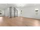 Bright living room features a glass-enclosed wine cellar and modern lighting at 3406 W Alline Ave, Tampa, FL 33611