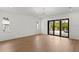 Living room with sliding glass doors leading to an outdoor patio and pool area at 3406 W Alline Ave, Tampa, FL 33611