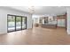 Expansive living space flowing into a chef's kitchen, with stainless steel appliances and large glass doors to the pool at 3406 W Alline Ave, Tampa, FL 33611